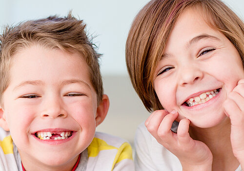 Cute little siblings making funny faces